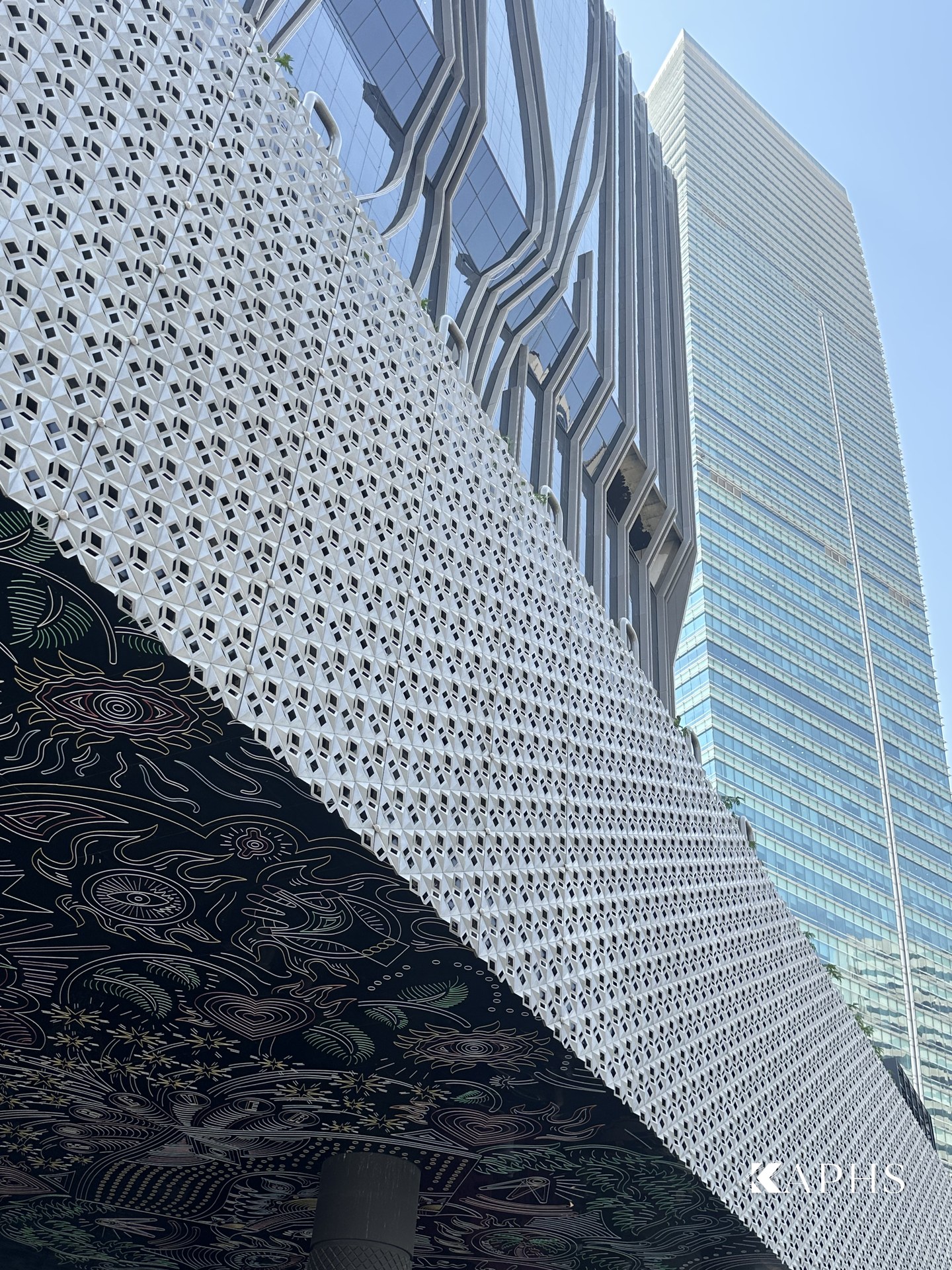 Cast-aluminium arrow-slit Mashrabiya screen wrapping the Mama Shelter Hotel podium, Dubai — KAPHS