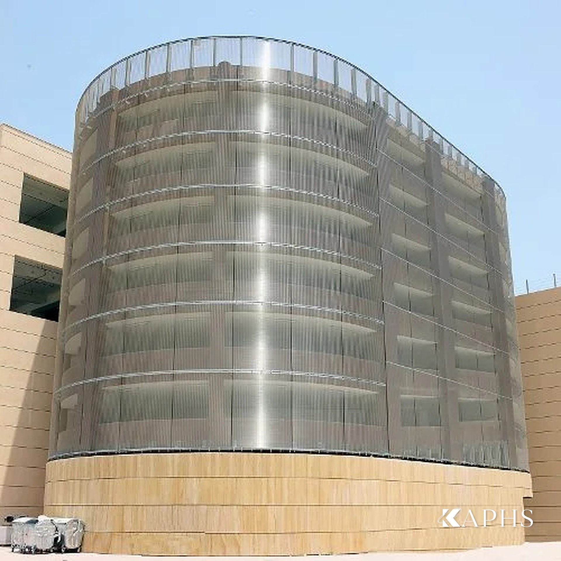 Curved stainless woven wire mesh façade on the Al Naeem Mall car park, Ras Al Khaimah UAE — KAPHS
