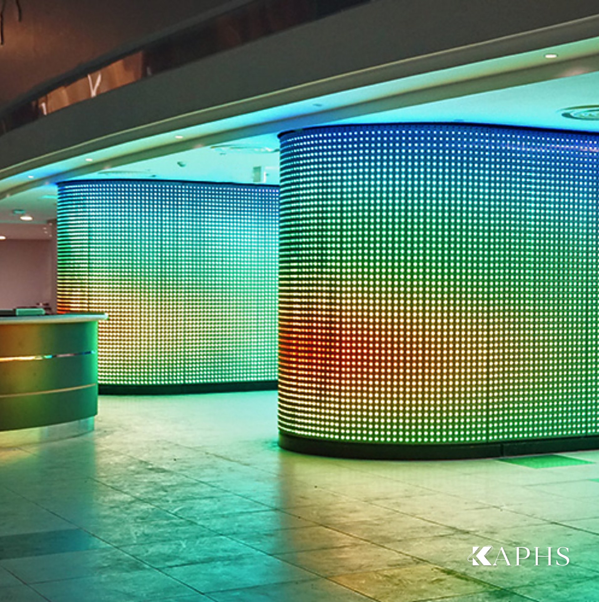 Programmable LED media mesh columns glowing in the Al Sadd Sports Club arena, Doha — KAPHS