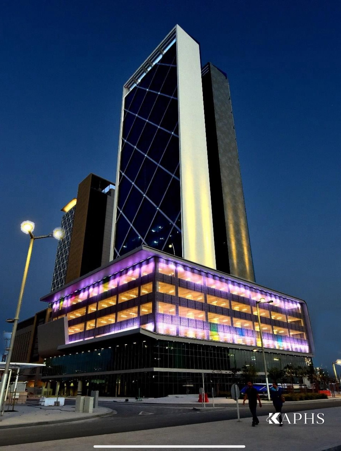 Al Sendian Tower at night, illuminated podium clad in EGLA-MONO painted architectural wire mesh, Qatar — KAPHS