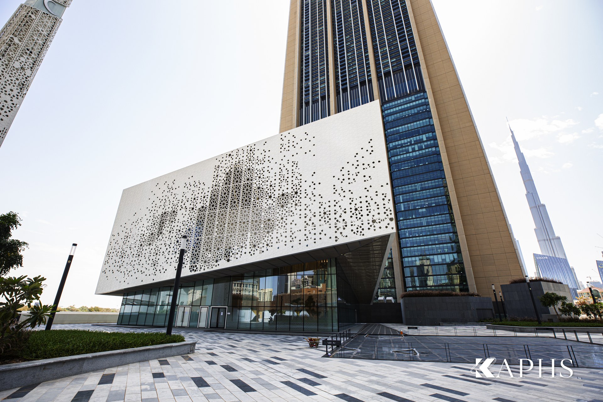 DIFC Gate Avenue Mosque clad in stainless architectural wire mesh, Burj Khalifa beyond — KAPHS