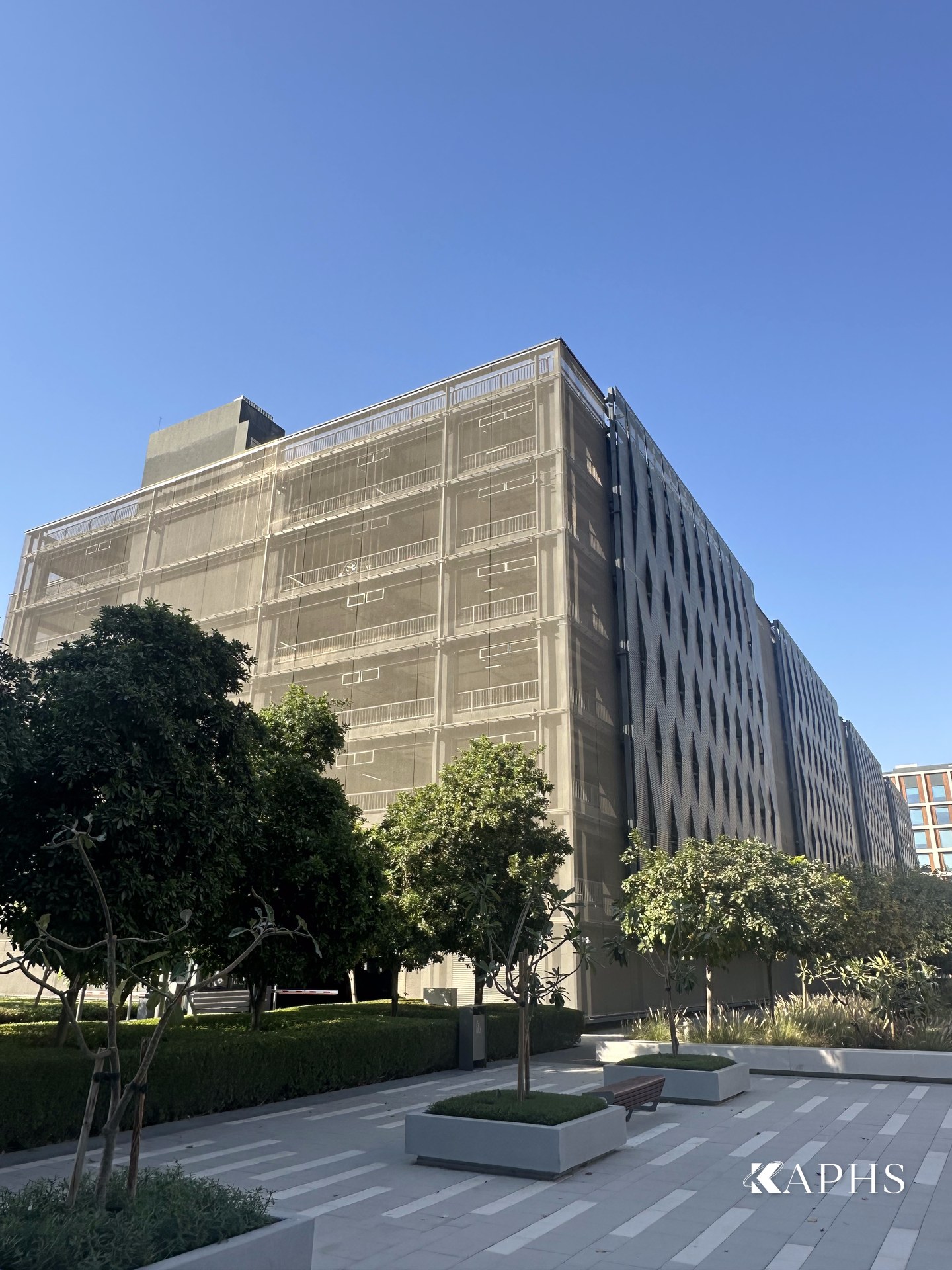 Stainless steel woven wire mesh façade concealing the Dubai Hills Business Park car park levels — KAPHS