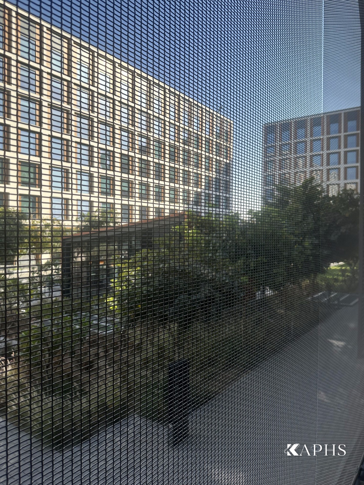 Angled view of the EGLA-TWIN stainless woven wire mesh car-park façade, Dubai Hills Estate — KAPHS