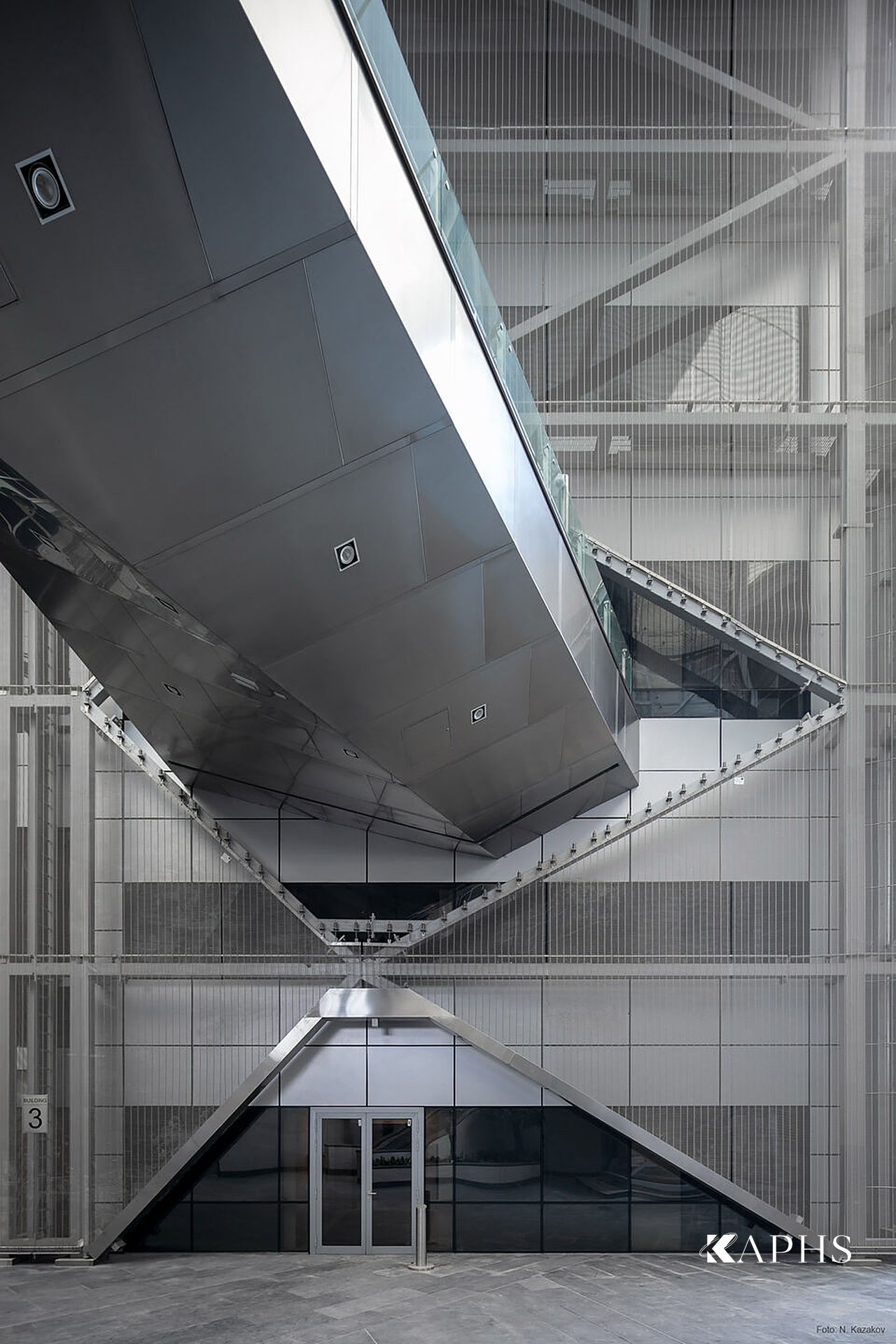Architectural wire mesh soffit and fall-protection screen at Energy City, Qatar — KAPHS