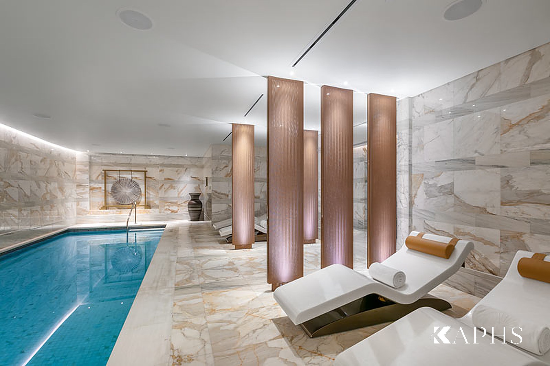 Copper-toned architectural wire mesh screens beside the spa pool at Mandarin Oriental Doha — KAPHS