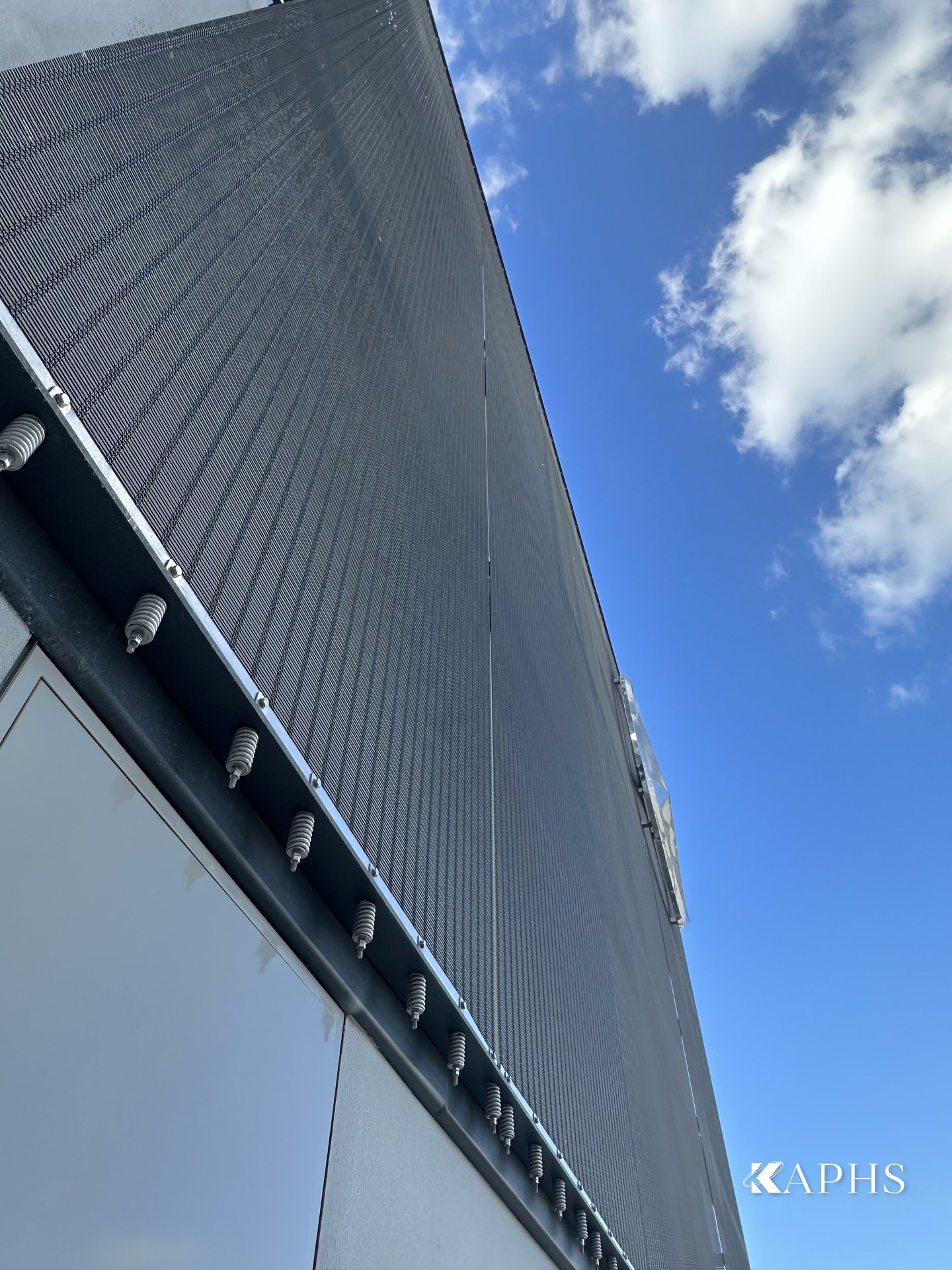 Edge detail of grey-painted architectural wire mesh cladding, Mercedes-Benz showroom d3 Dubai — KAPHS