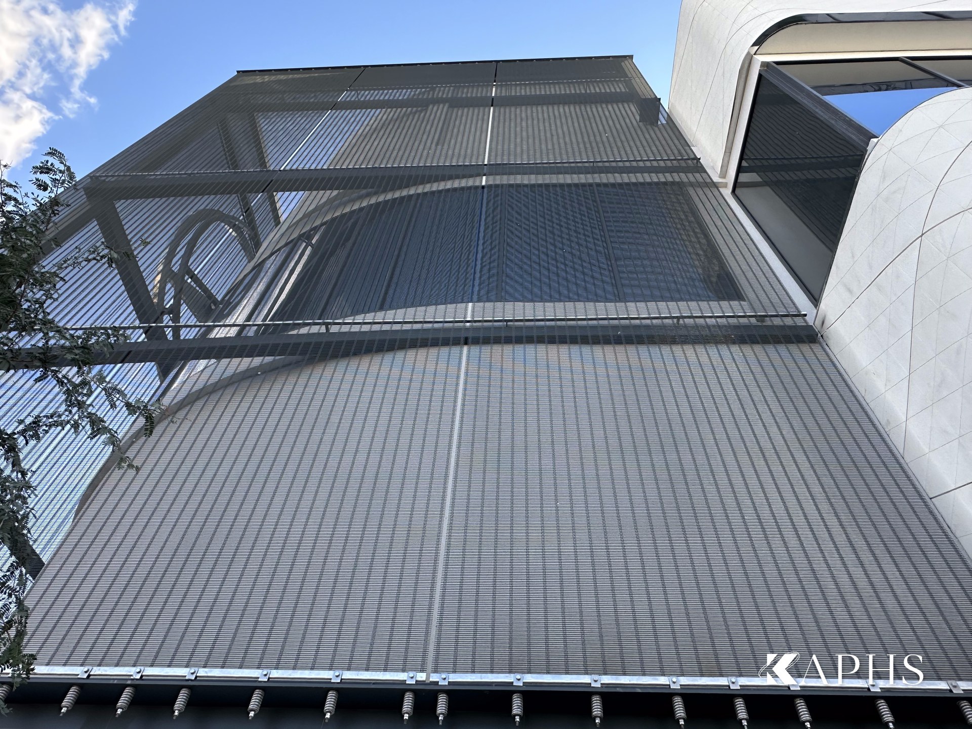 Full-height DOGLIA-TRIO architectural wire mesh cladding at the Mercedes-Benz d3 showroom — KAPHS