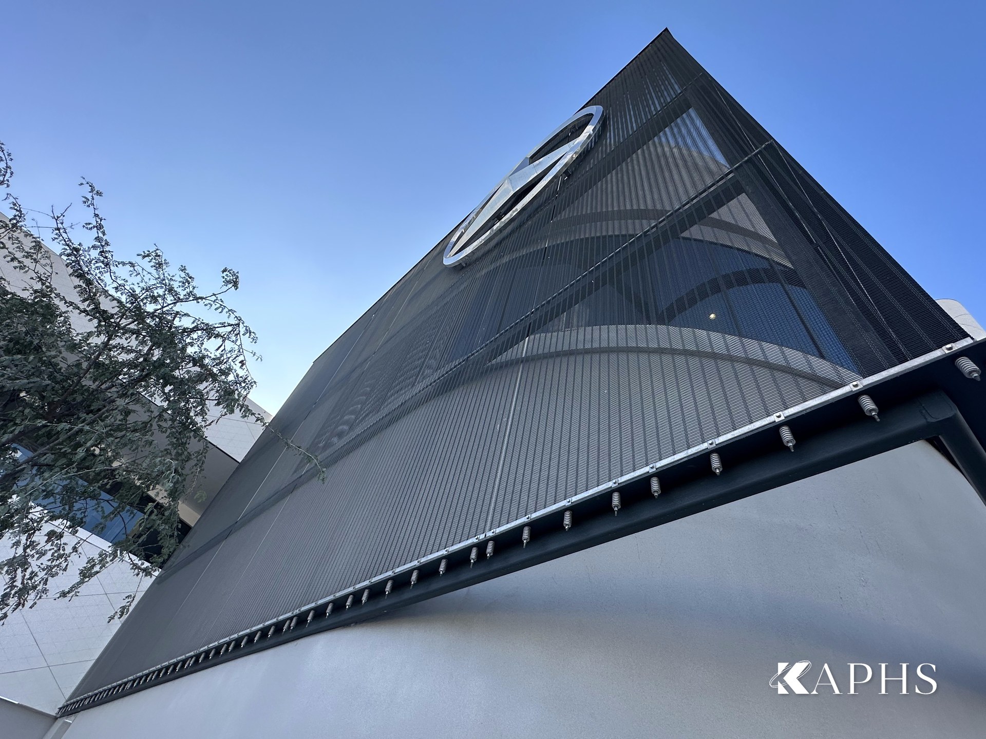 Triangular architectural wire mesh façade detail, Mercedes-Benz flagship showroom Dubai — KAPHS
