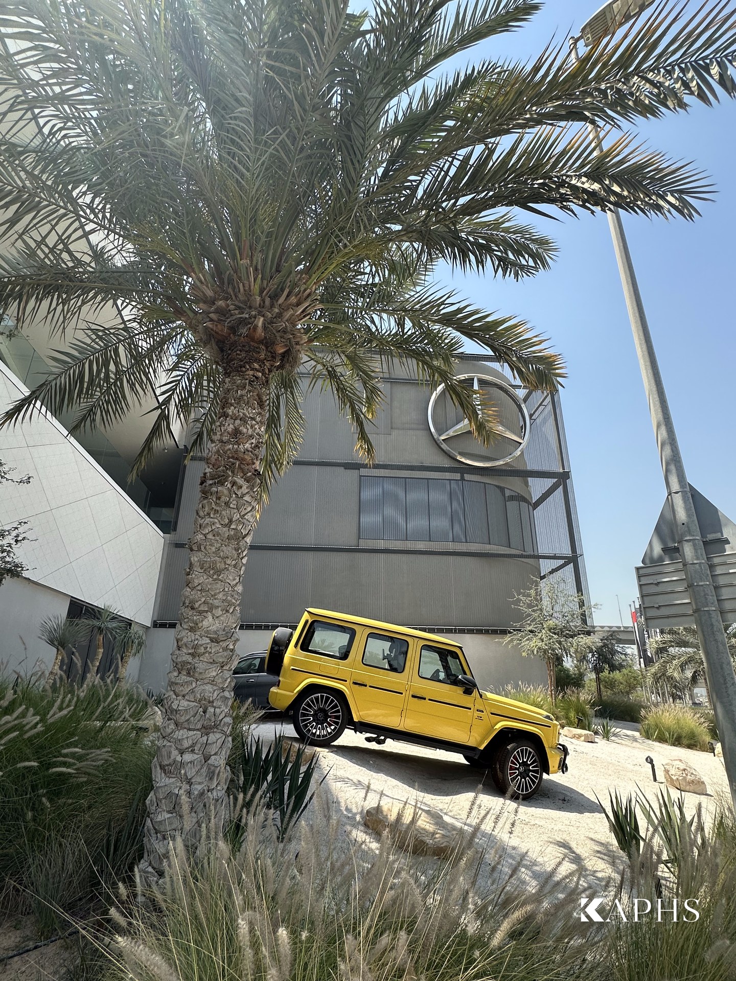 Mercedes-Benz AMG G-Class beside the architectural wire mesh showroom façade, Dubai — KAPHS
