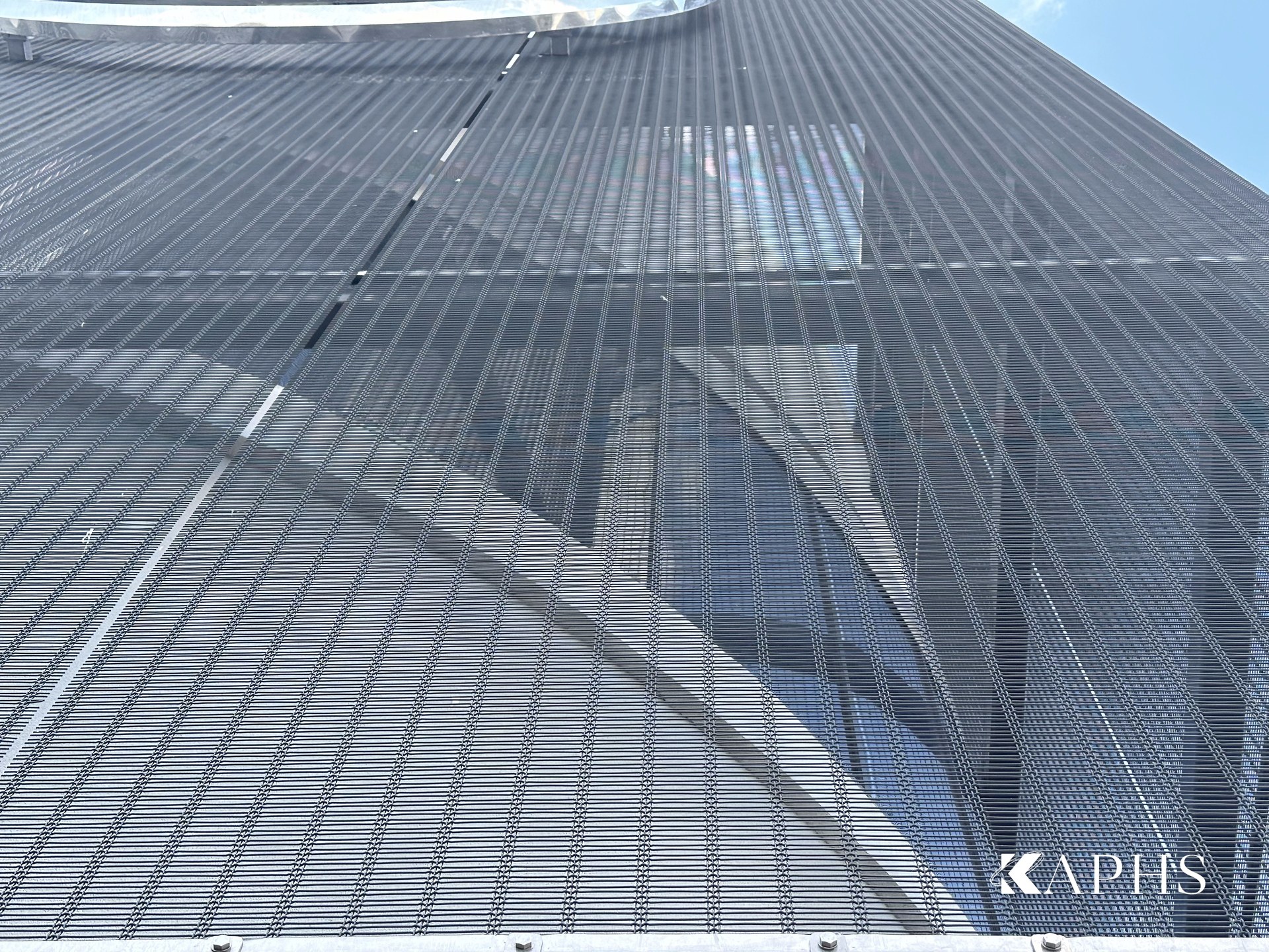 Close-up of the woven DOGLIA-TRIO architectural wire mesh, Mercedes-Benz showroom Dubai — KAPHS
