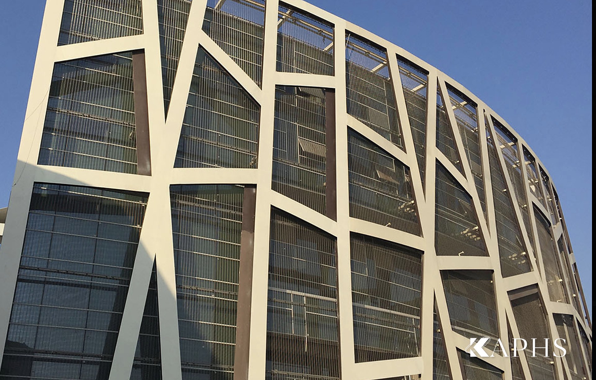 Close-up of the architectural wire mesh solar-shading envelope on the ONGC HQ atrium, New Delhi — KAPHS