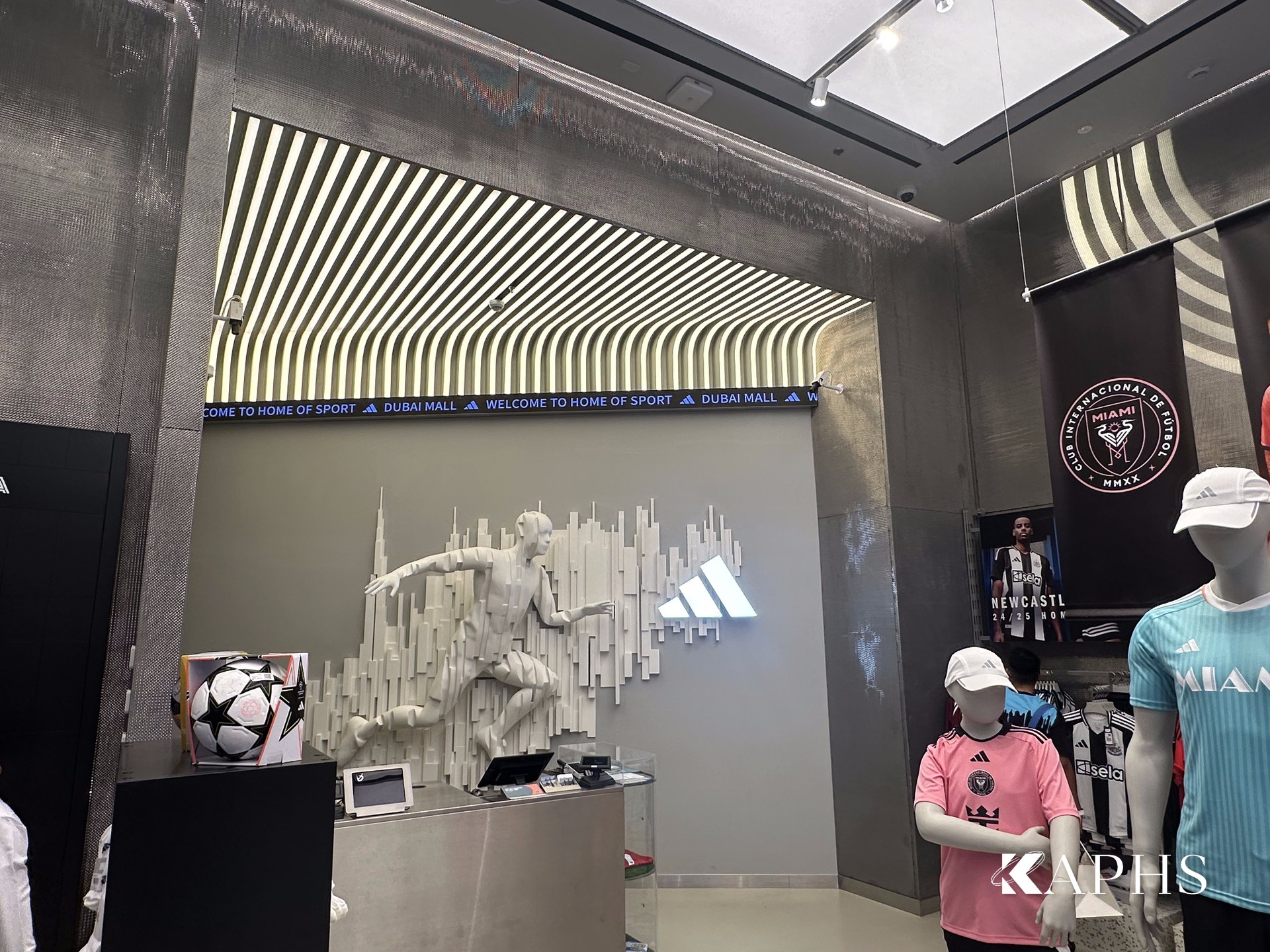 DWM Mosa decorative wire mesh backdrop at the Adidas Young Athletes store entrance, Dubai Mall — KAPHS
