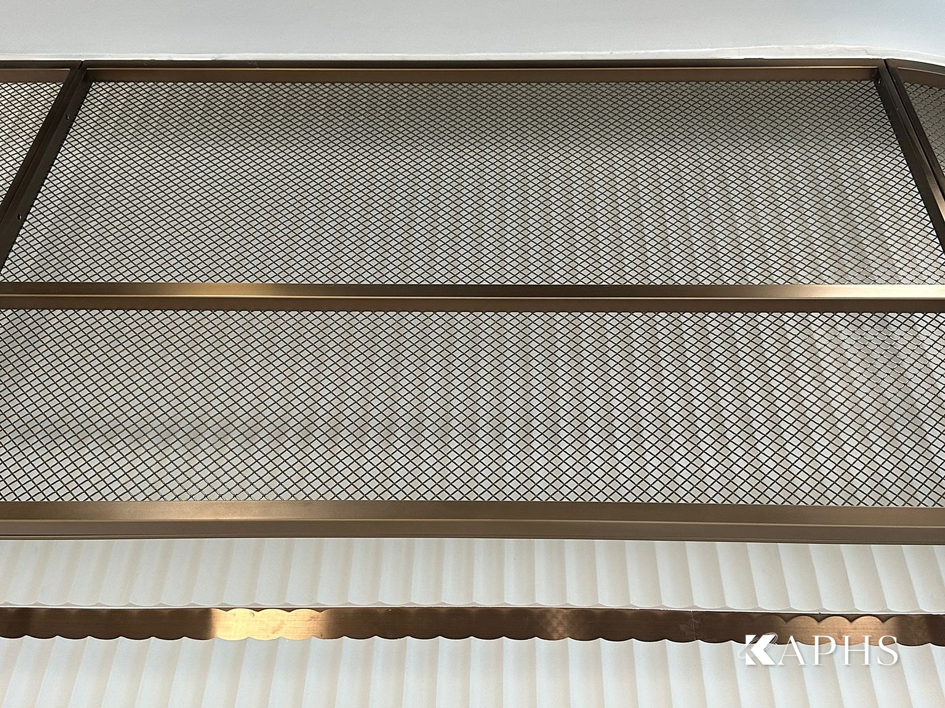 Close-up of bronze flat-wire decorative wire mesh panel at the DAFZA Food Court, Dubai — KAPHS