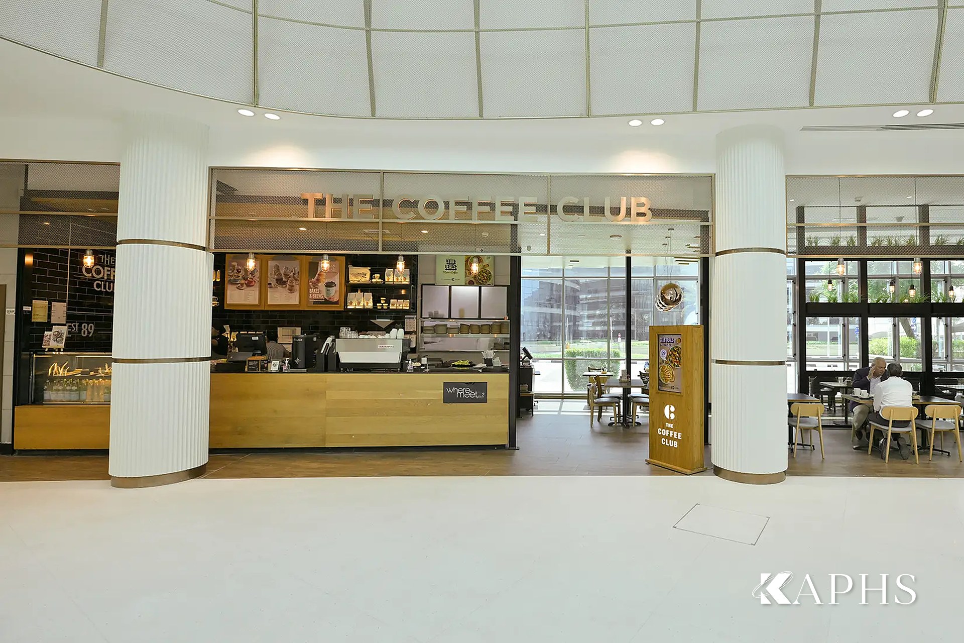 Coffee outlet with bronze flat-wire decorative wire mesh feature, DAFZA Food Court Dubai — KAPHS