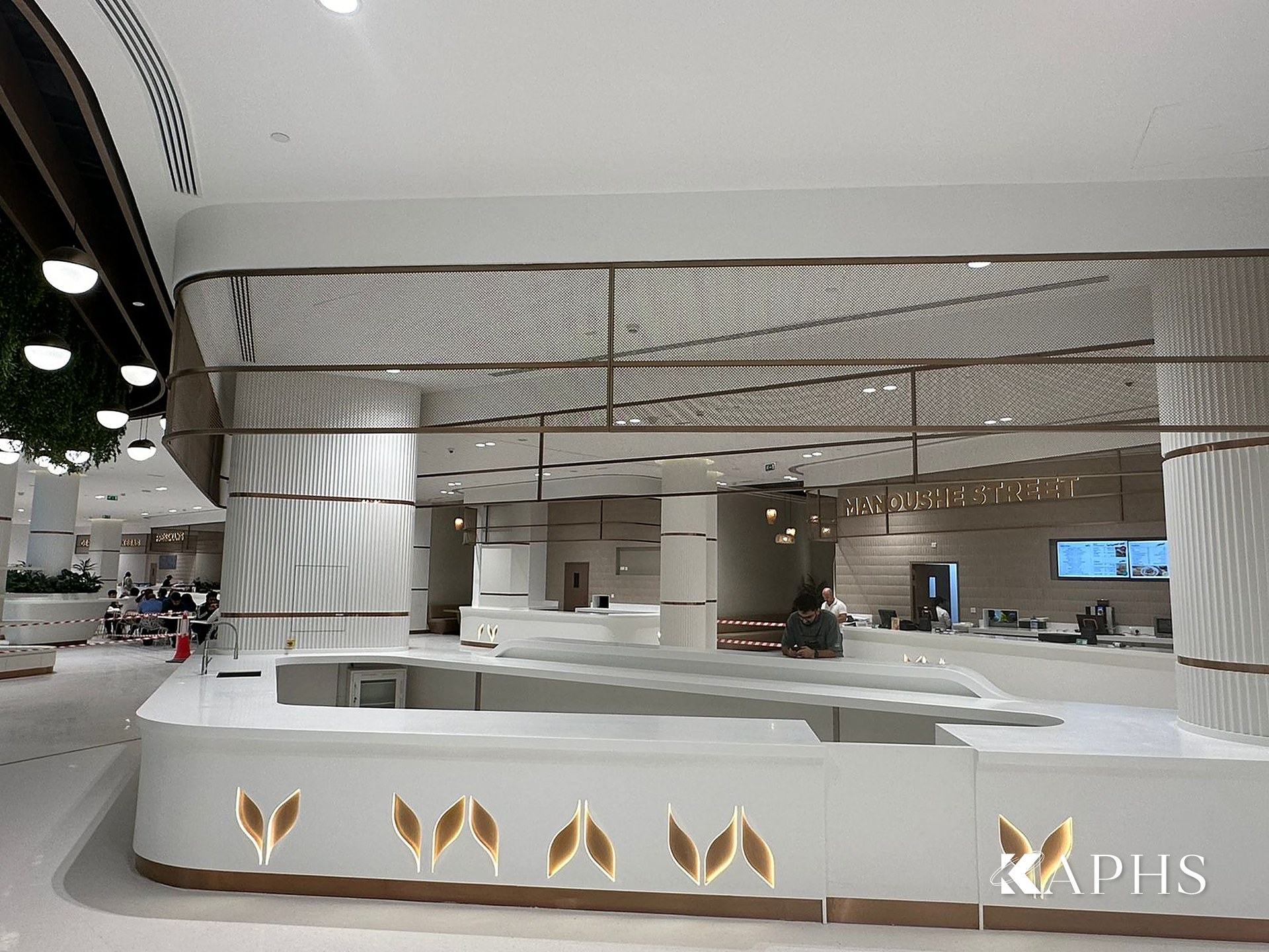 DAFZA Food Court servery with bronze decorative wire mesh cladding, Dubai — KAPHS