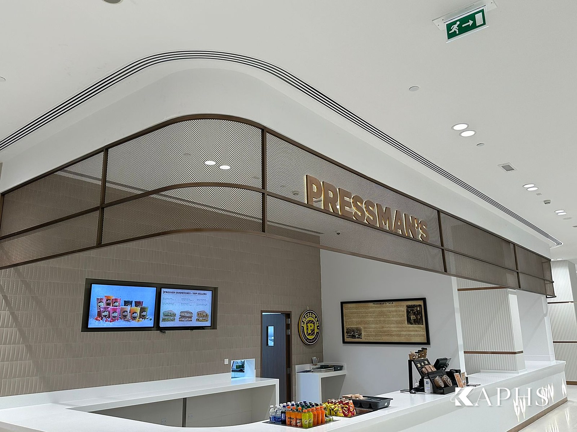 Pressmans stall with bronze decorative wire mesh feature panel, DAFZA Food Court Dubai — KAPHS
