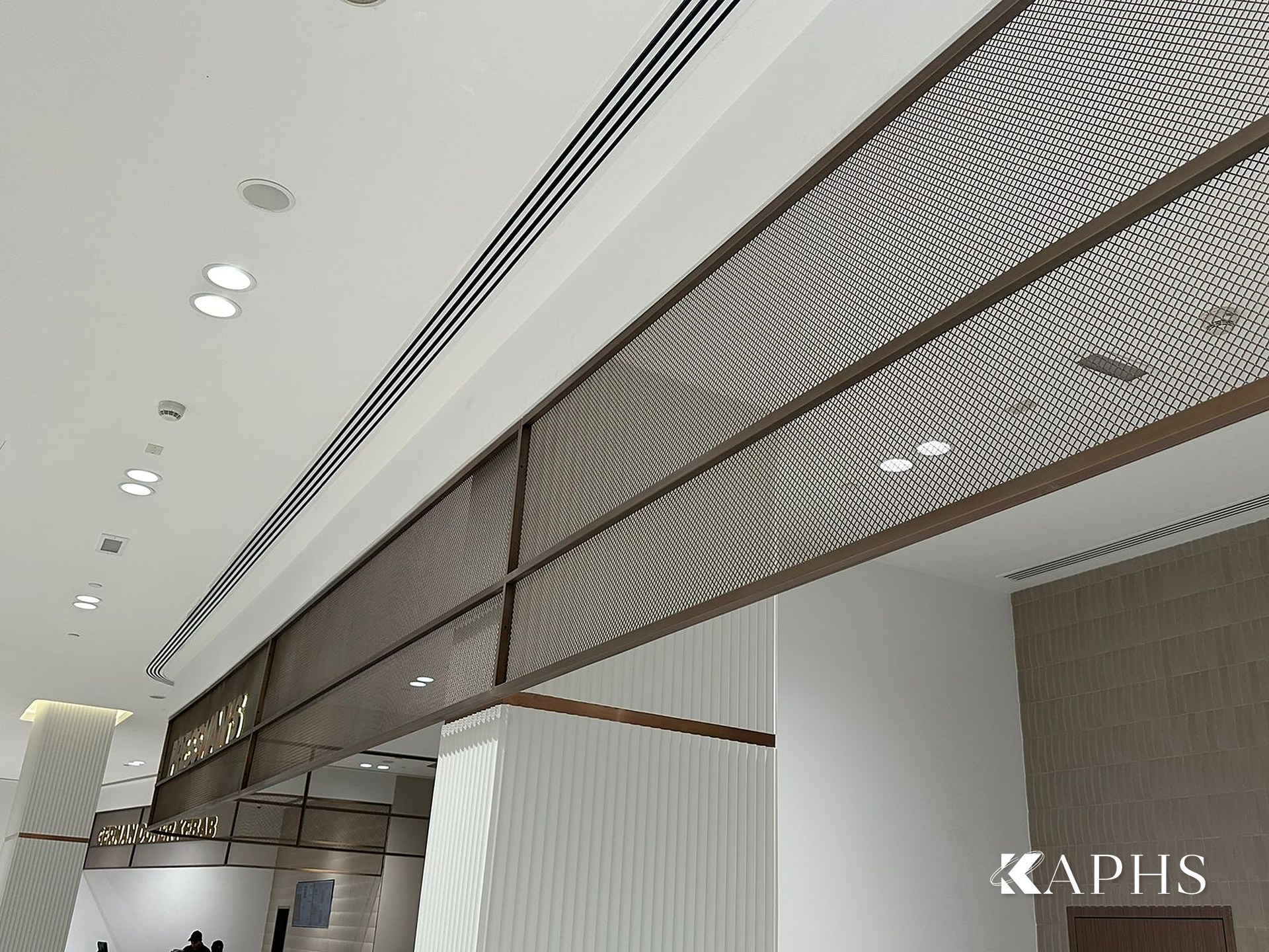 Bronze flat-wire decorative wire mesh ceiling feature, DAFZA Food Court Dubai — KAPHS