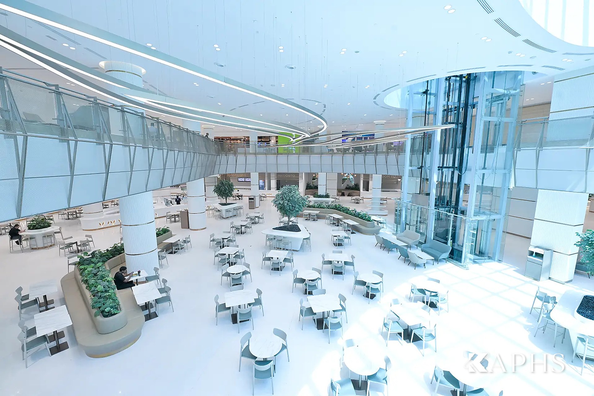 DAFZA Food Court seating area beneath the bronze decorative wire mesh feature, Dubai — KAPHS