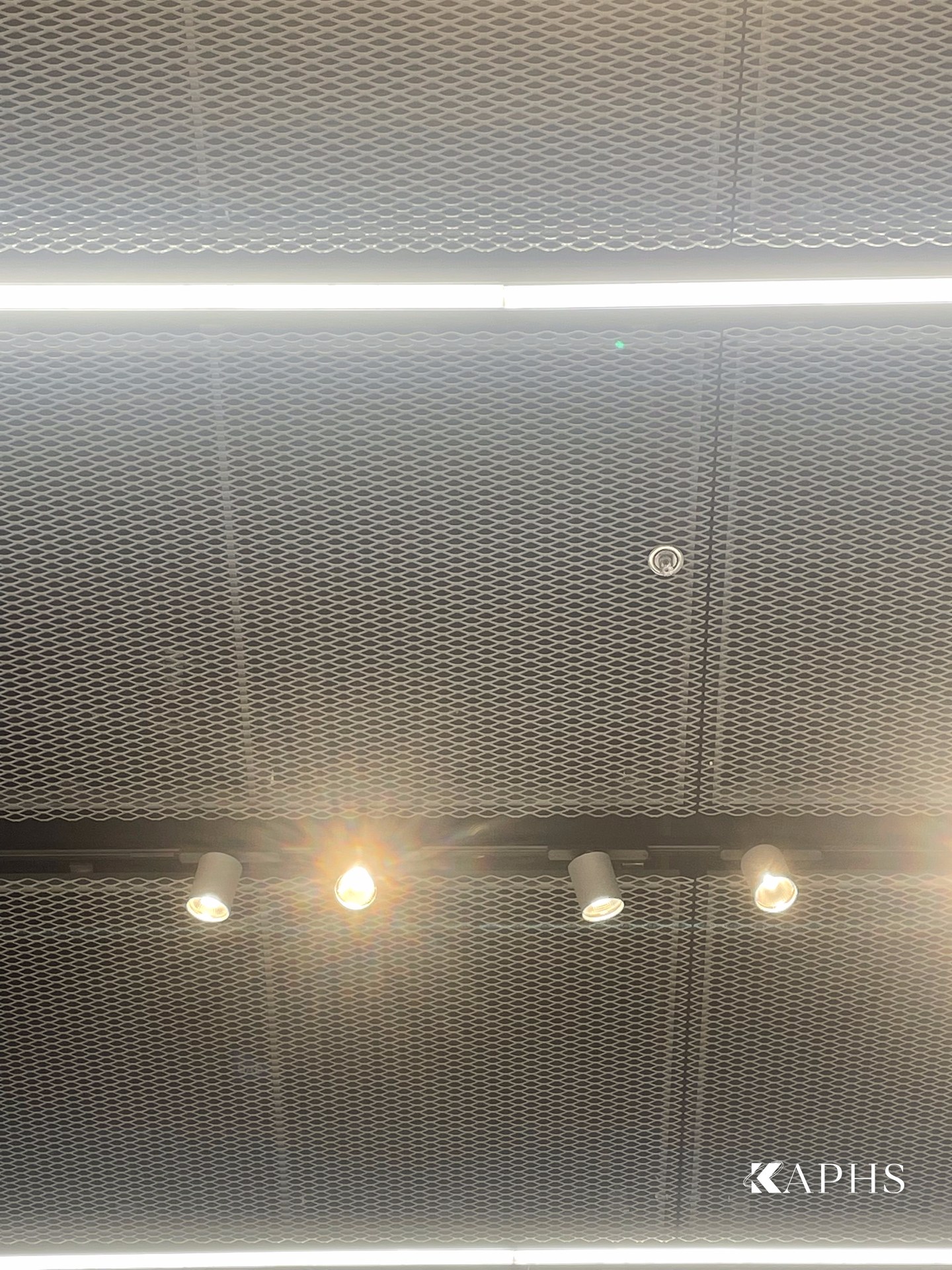 Close-up of ExpandForm Kiel diamond expanded metal mesh ceiling with integrated lighting, Adidas Originals — KAPHS