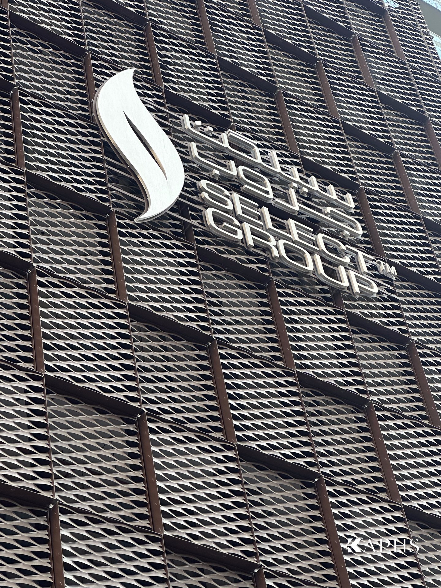 Select Group signage on the ExpandForm expanded metal mesh façade, Marina Gate Tower 3 Dubai — KAPHS