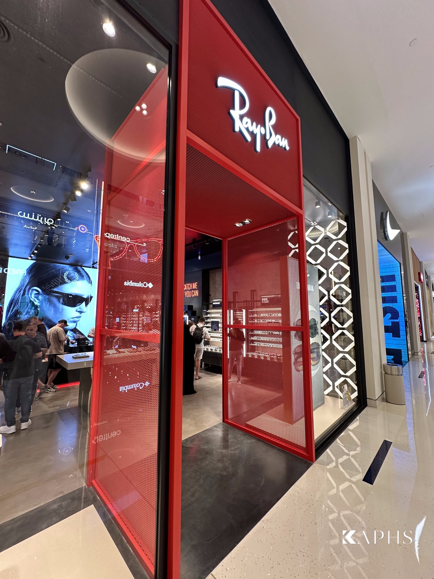 Red ExpandForm expanded metal mesh storefront at the Ray-Ban store, The Dubai Mall — KAPHS