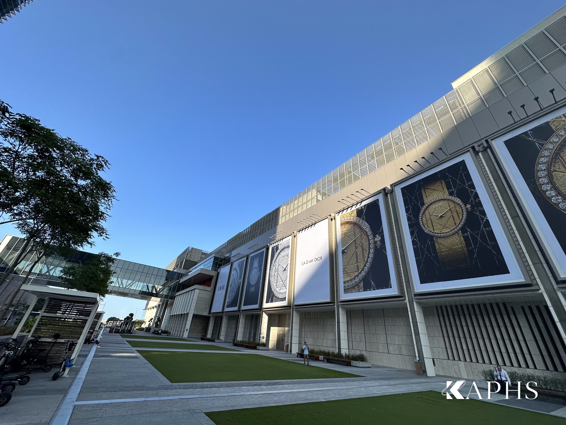 The Galleria promenade with the ExpandForm expanded metal mesh rooftop screen above, Abu Dhabi — KAPHS