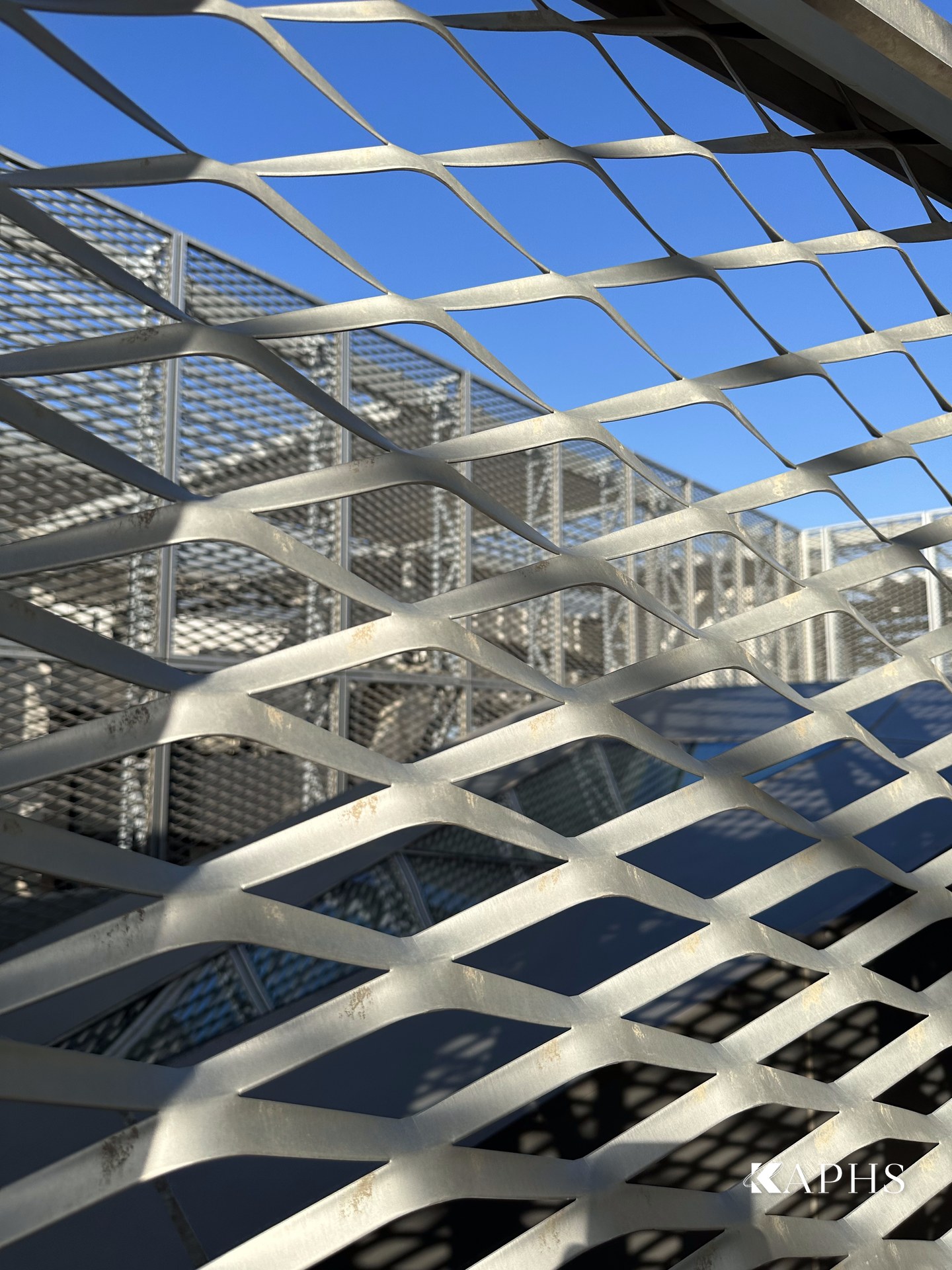 ExpandForm expanded metal mesh diamond pattern against the sky, The Galleria Al Maryah Island — KAPHS