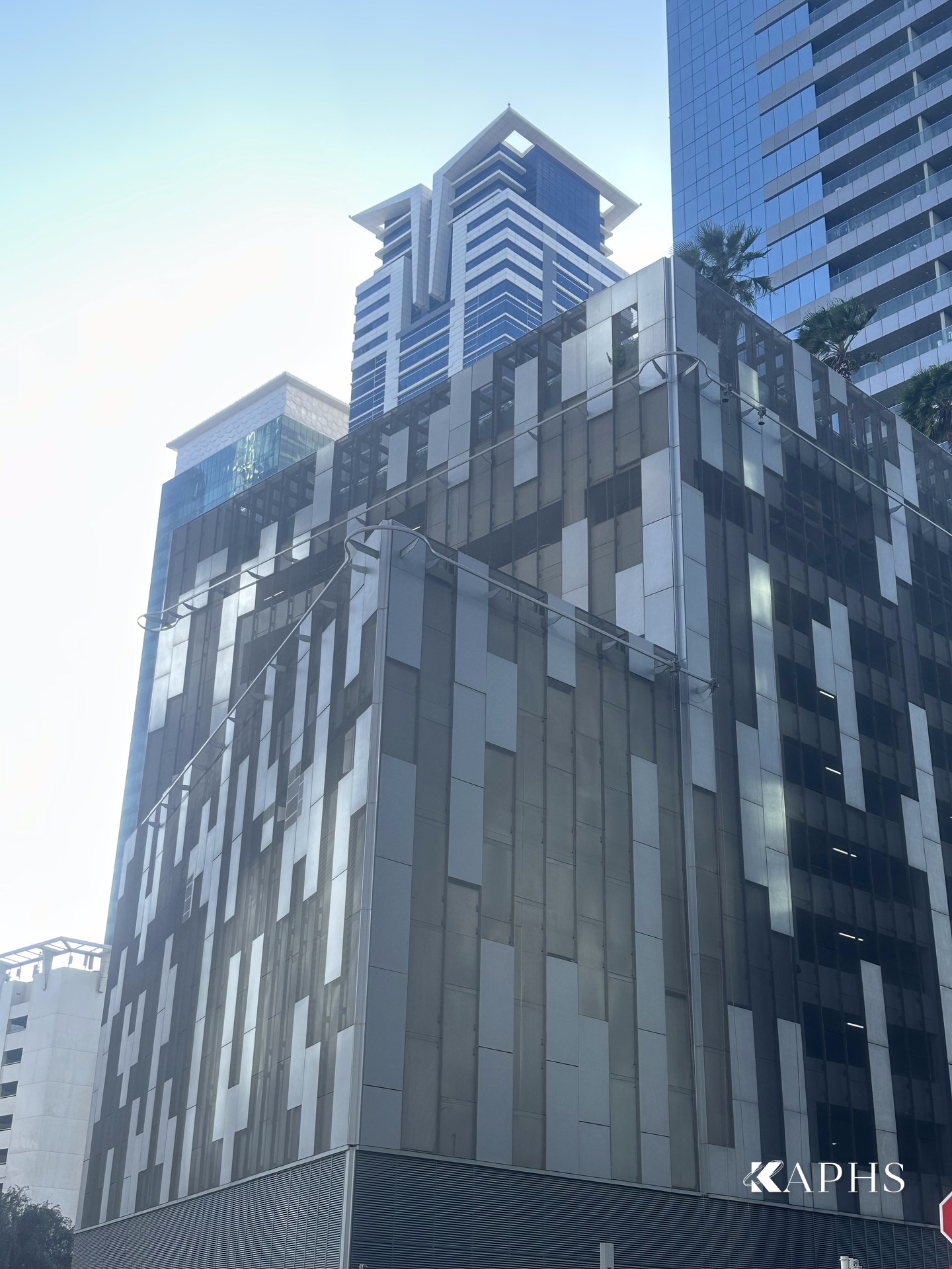 Tiara United Towers car-park podium screened in ExpandForm expanded metal mesh, Dubai — KAPHS