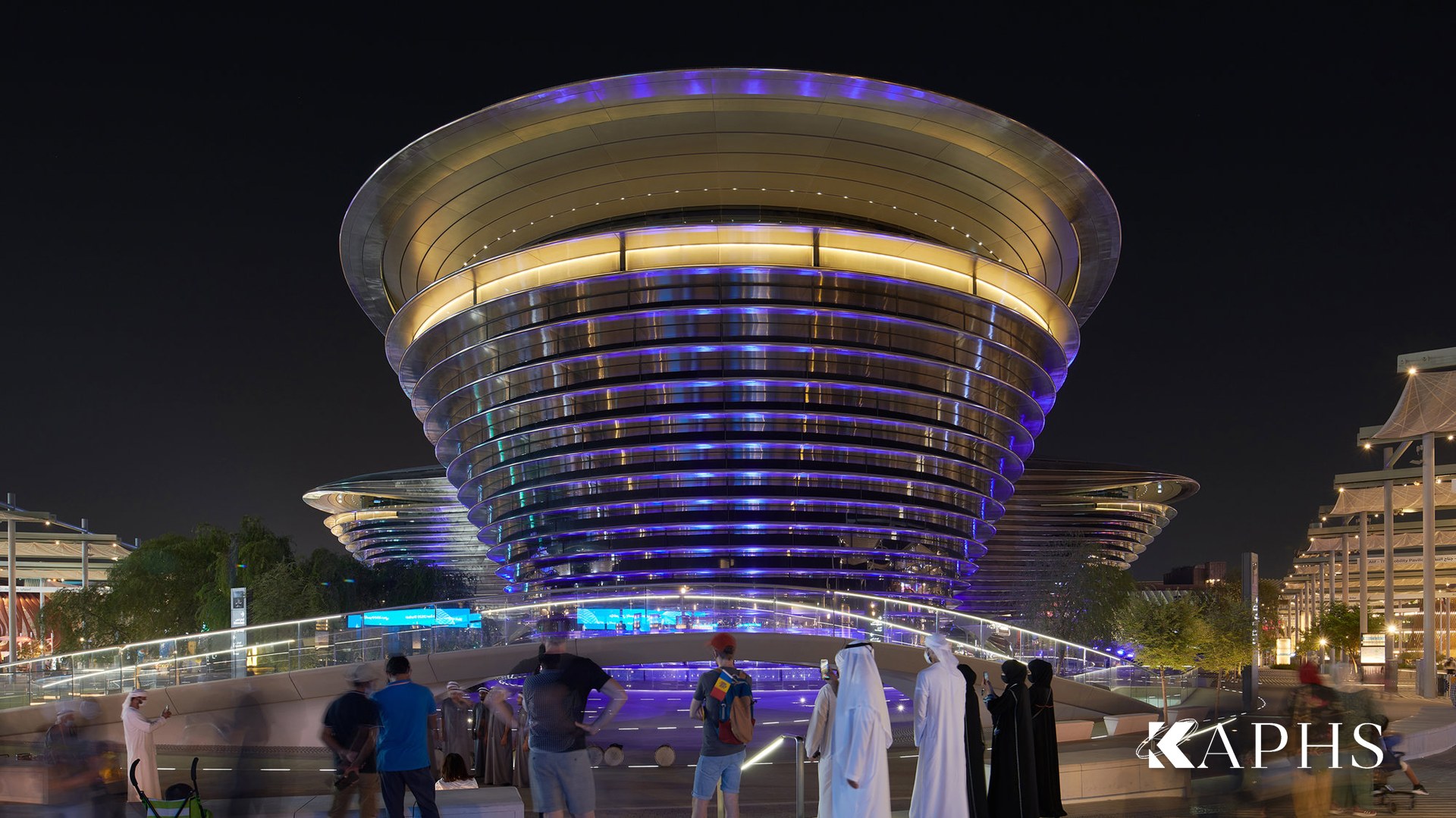 The Mobility Pavilion lit at dusk behind curved NorthGlass jumbo glass, Expo City Dubai — KAPHS