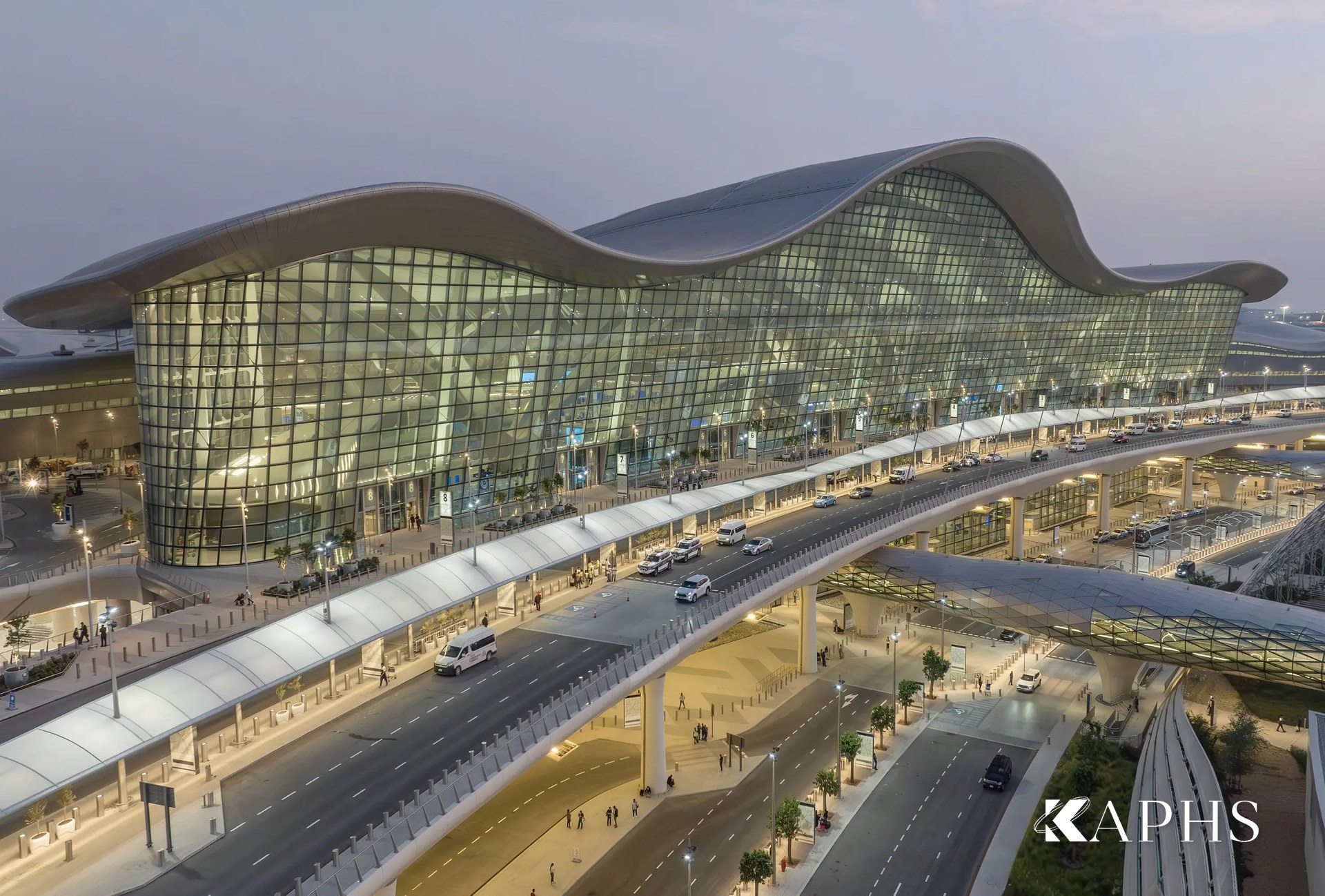 Curved NorthGlass jumbo glass terminal envelope at Zayed International Airport, Abu Dhabi — KAPHS