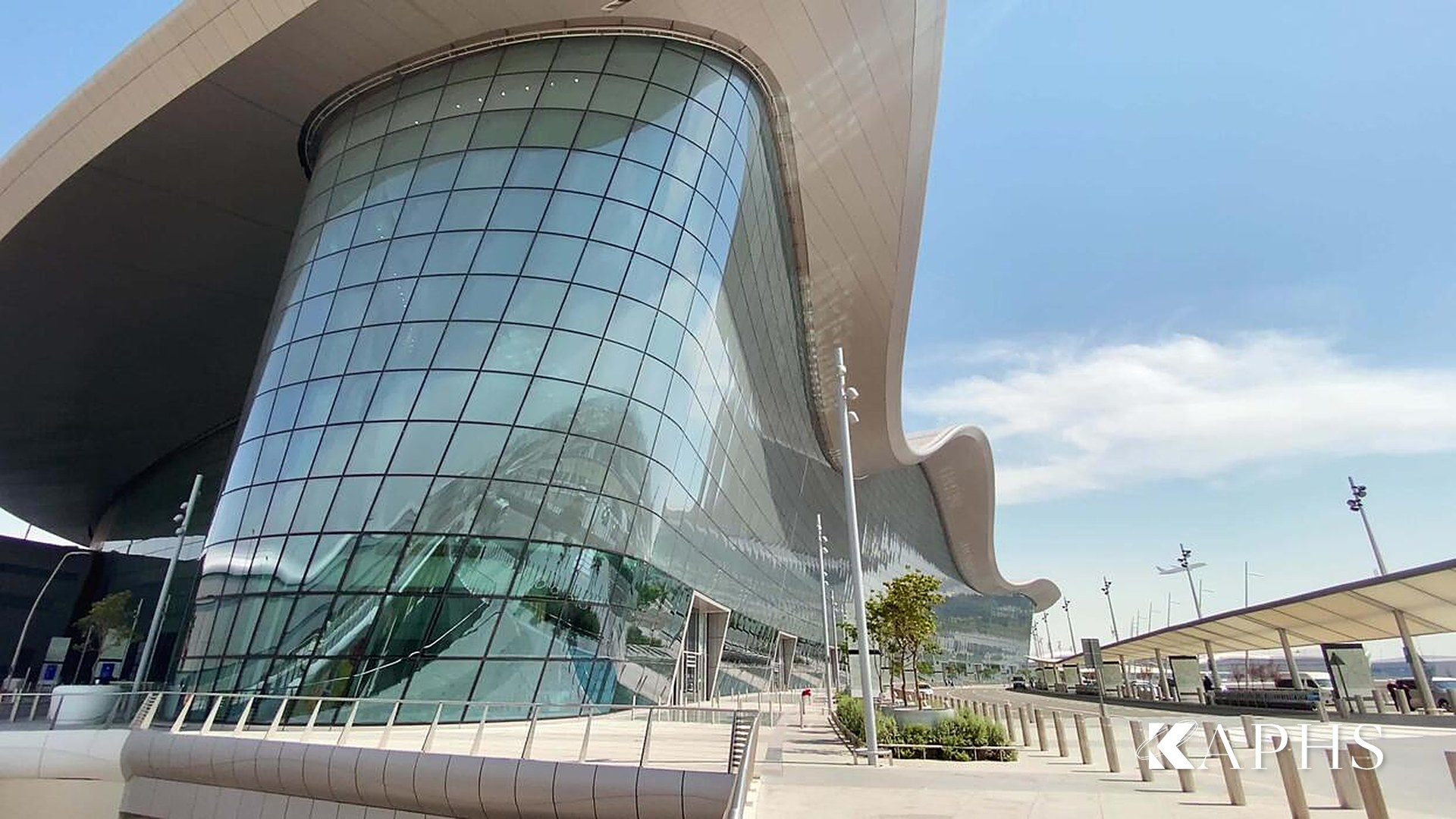 Curved NorthGlass jumbo glass façade detail at Zayed International Airport, Abu Dhabi — KAPHS
