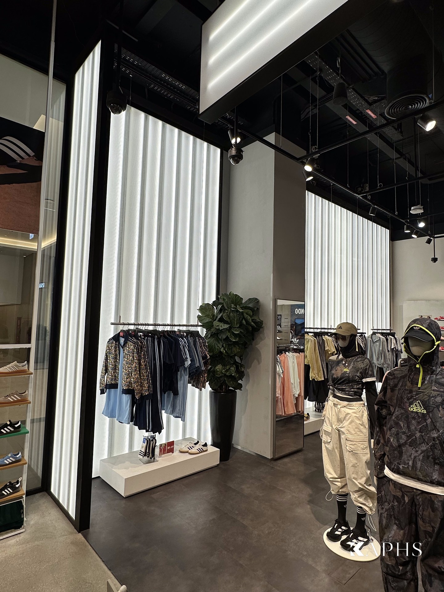 Translucent LINIT U-channel glass wall at the adidas store, Dubai Hills Mall — KAPHS