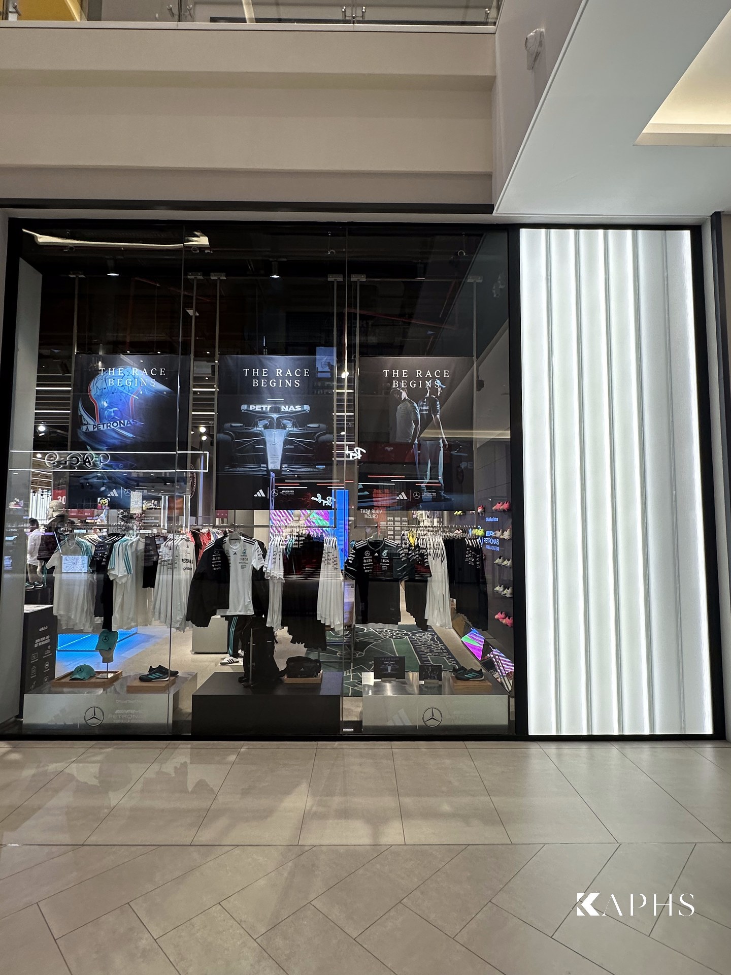 adidas store window with backlit LINIT U-channel glass wall, Dubai Hills Mall — KAPHS