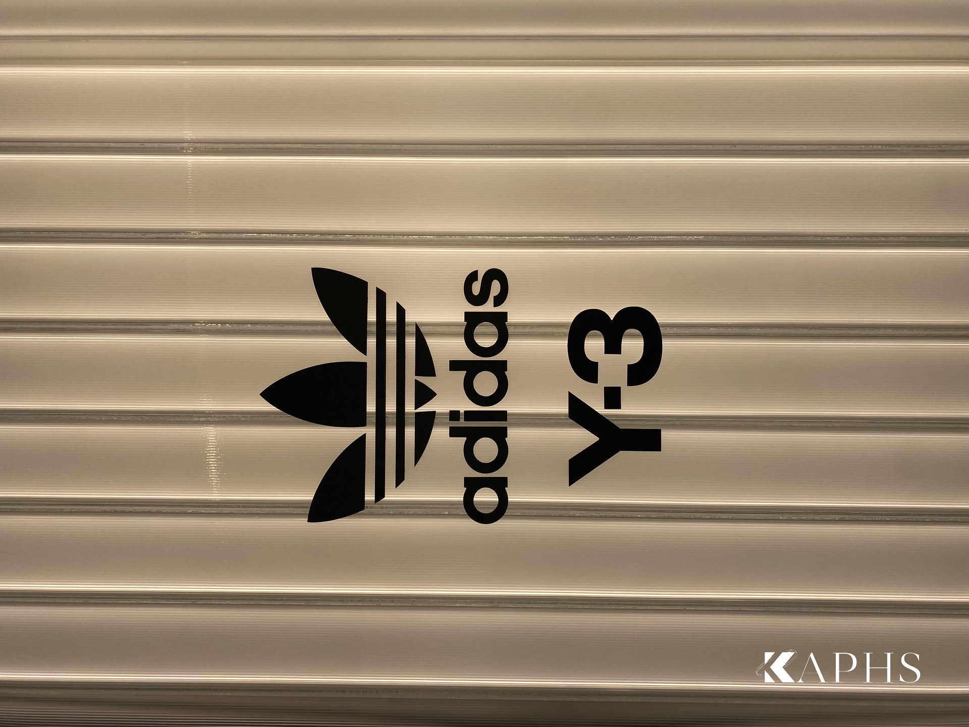 Backlit U-channel glass display backdrop, adidas Flagship Store Dubai Mall — KAPHS