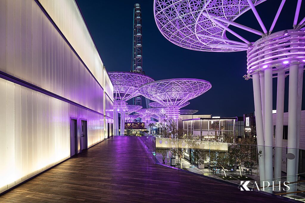 Backlit LINIT U-channel glass wall along the Bluewaters Island promenade at night, Dubai — KAPHS