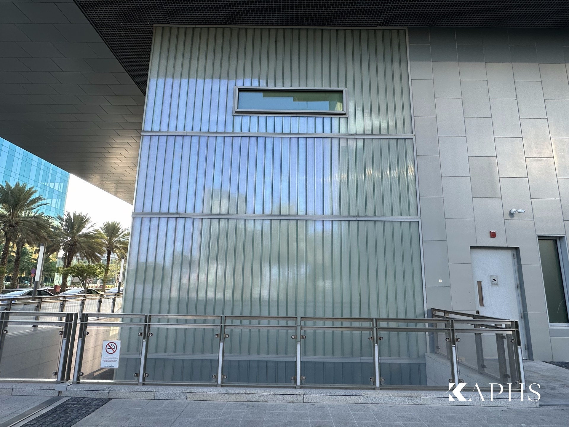 Cleveland Clinic Abu Dhabi — translucent U-channel glass façade elevation, KAPHS