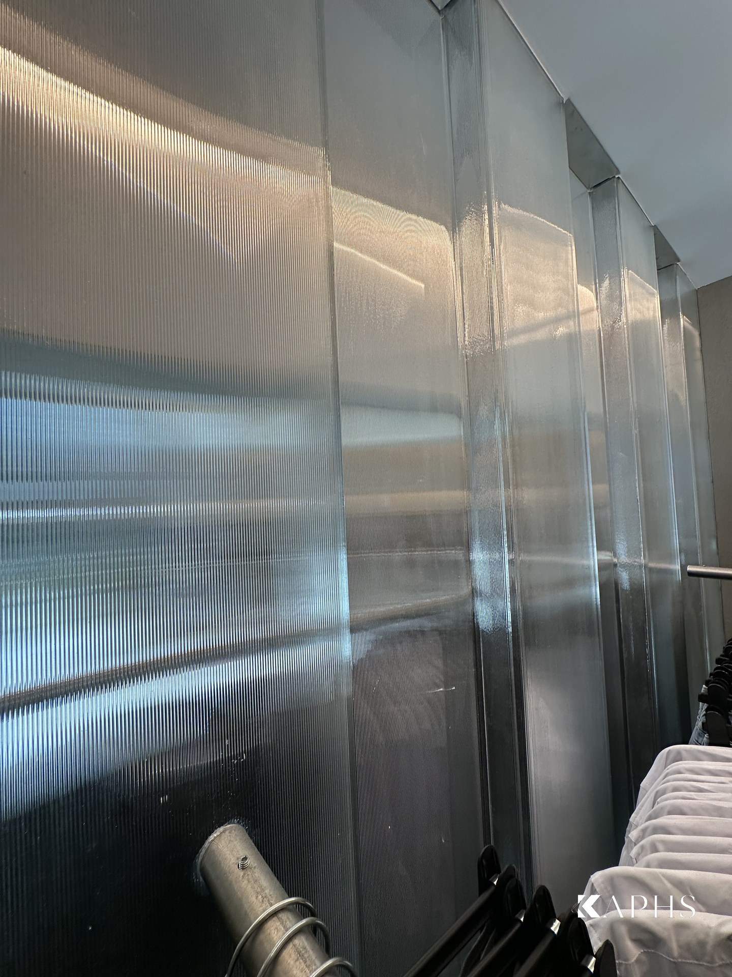 Close-up of the ribbed LINIT U-channel glass profiles, H&M Yas Mall — KAPHS
