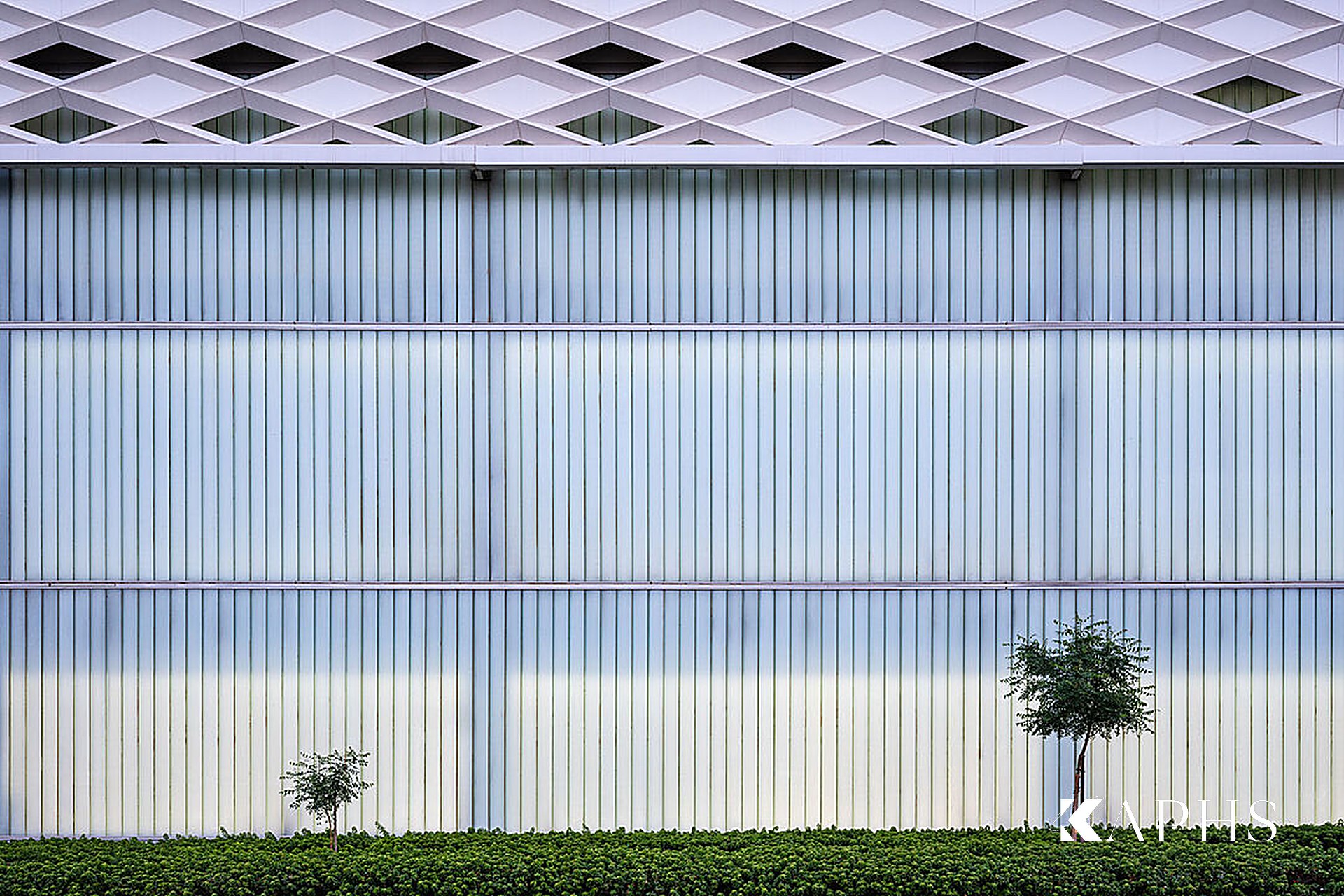 Tennis courts lit through LINIT U-channel glass walls, Kuwait International Tennis Complex — KAPHS