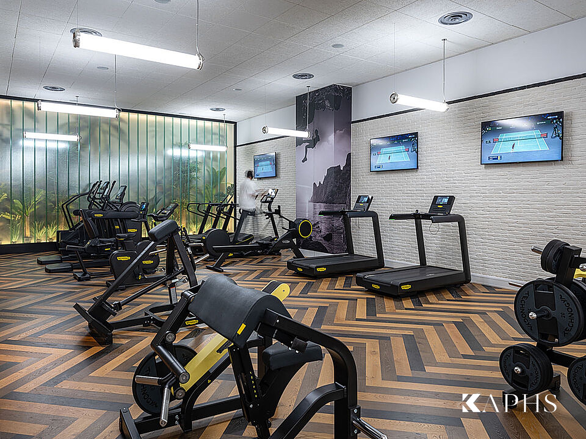 Kuwait International Tennis Complex courts beneath the translucent channel glass façade — KAPHS