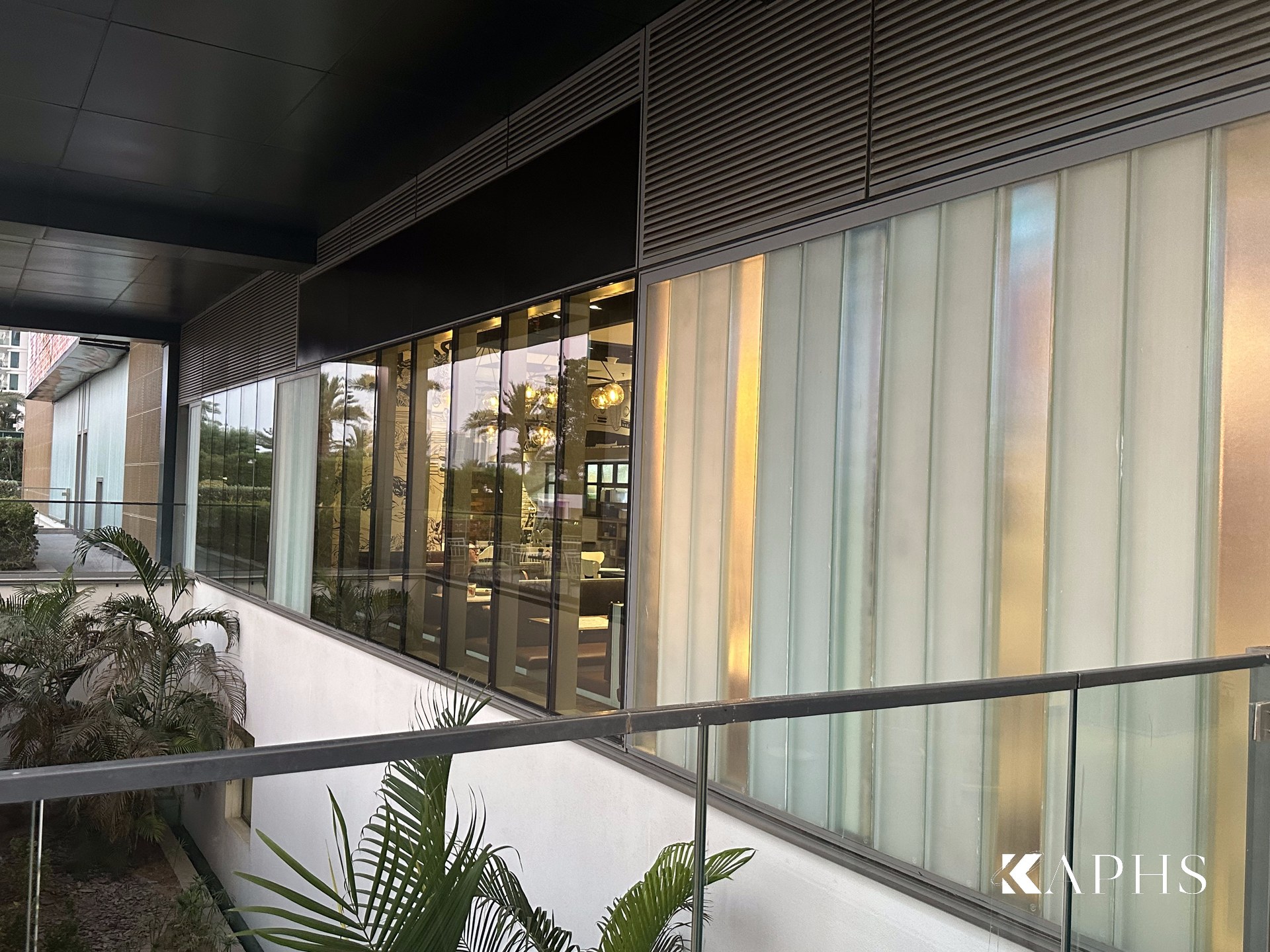 Translucent LINIT U-channel glass cladding beside the walkway at The Beach, JBR — KAPHS